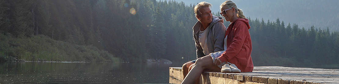 Mature couple spending time together at a lake.