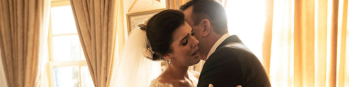 A newly married couple embracing each other. 