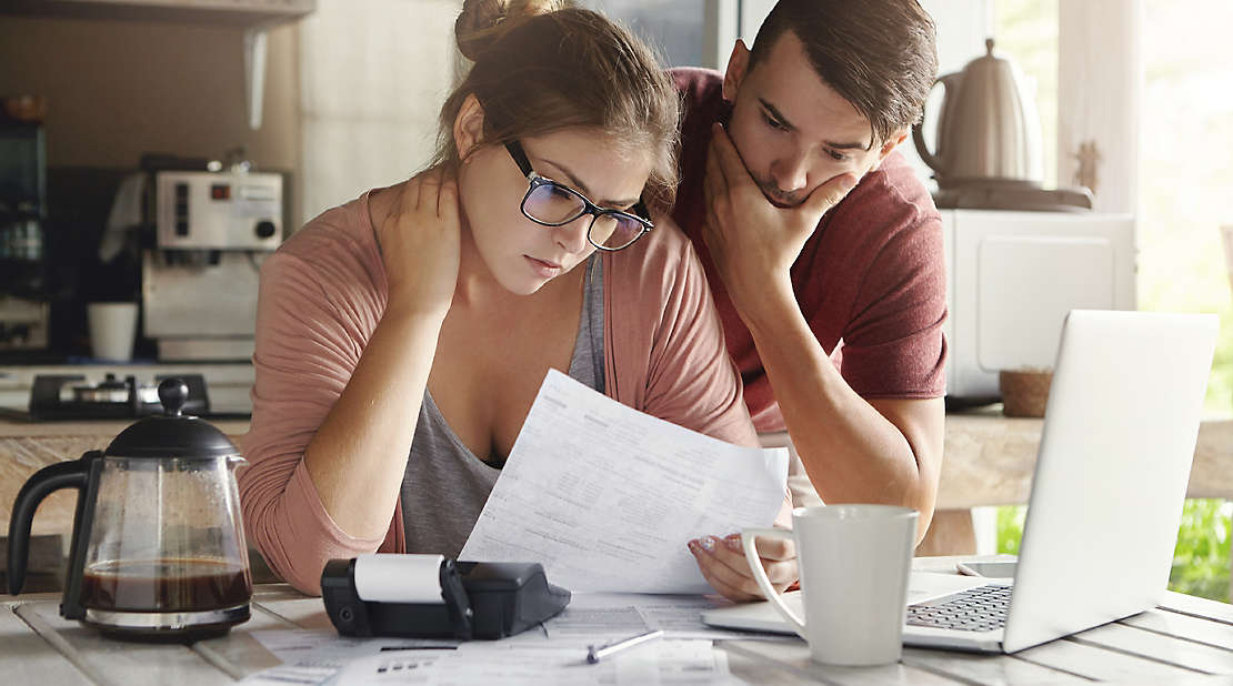 emotional cost of debt, couple dealing with debt