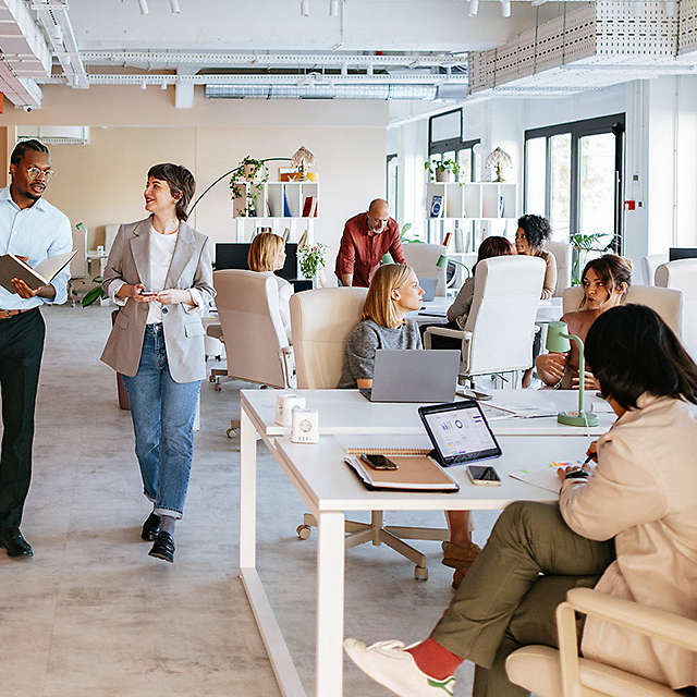 Employees walking around the office