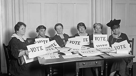 Woman holding vote signs