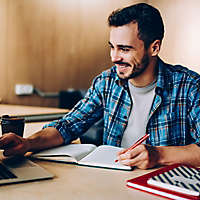 Man working at a desk.