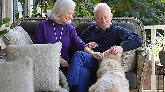 Jill and Mike sitting on porch.