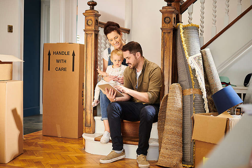 Couple moving in with their toddler-aged child to a new home