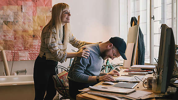 2 coworkers having fun in the office