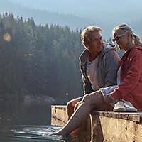 Mature couple spending time together at a lake.