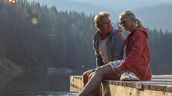 Mature couple spending time together at a lake.