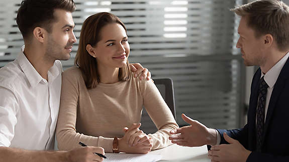 Couple meeting with an agent.