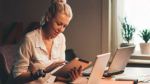 Women working at her desk.