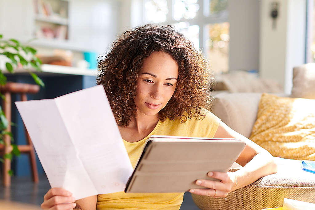 Young women looking at paperwork.