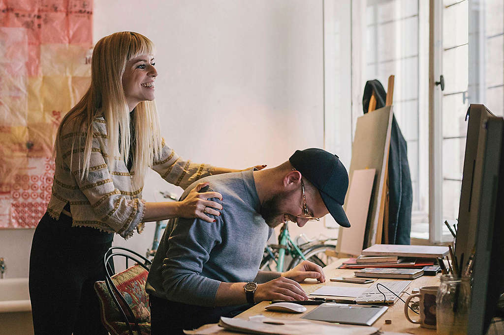 Young couple at desk