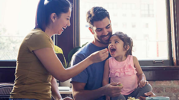 Young parents with their daughter 