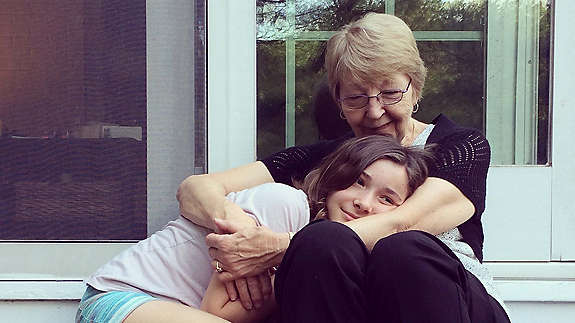 Grandmother embracing her grand-daughter