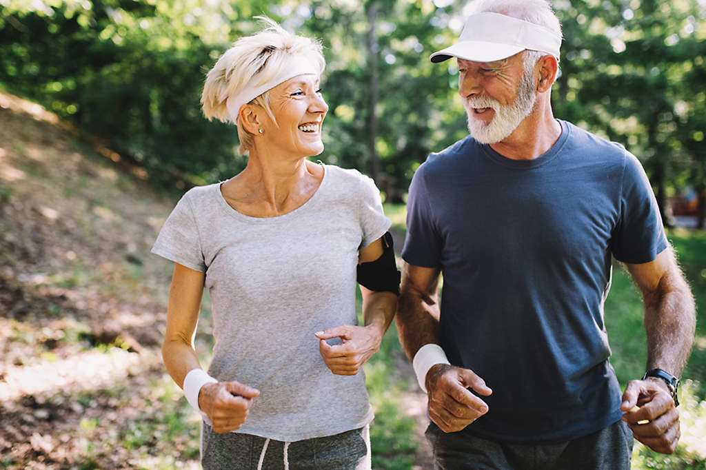 Happy senior people running to stay healthy and lose weight