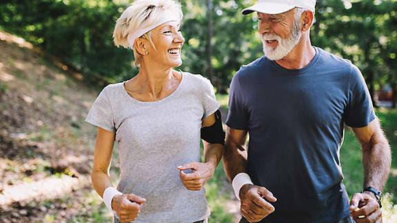 Happy senior people running to stay healthy and lose weight