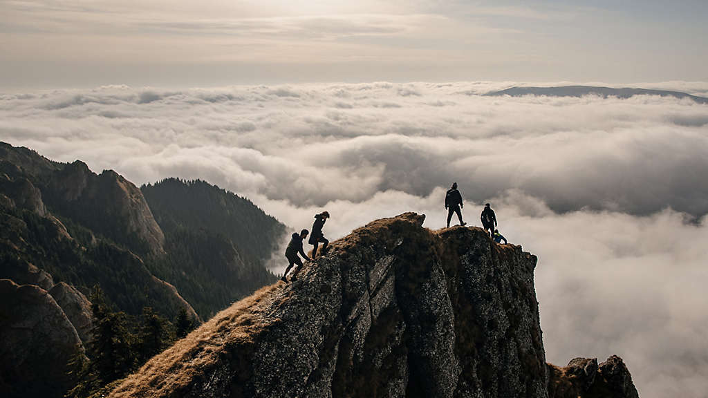 Hikers on a vantage with a wide view.