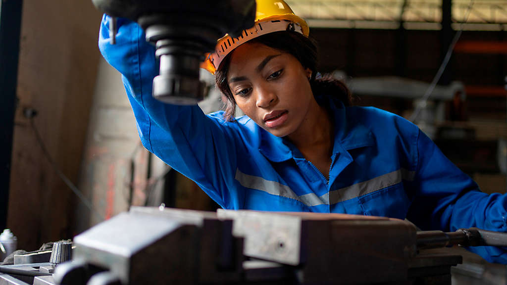 Woman working on machinery