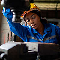 Woman working on machinery