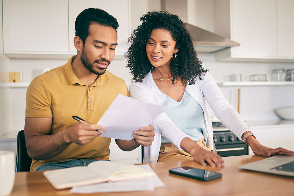 Couple sitting at the kitchen table