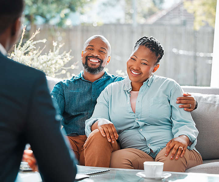 Couple working with advisor for insurance