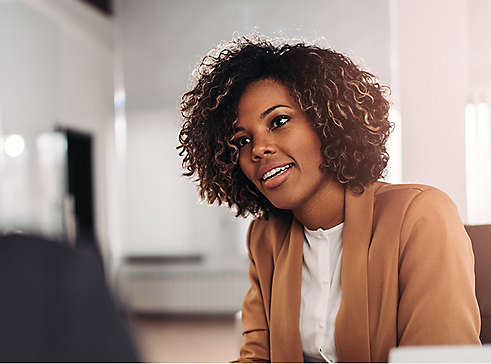 Female agent smiling and talking to a female client