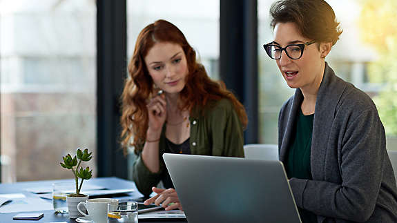 Women working together on computer