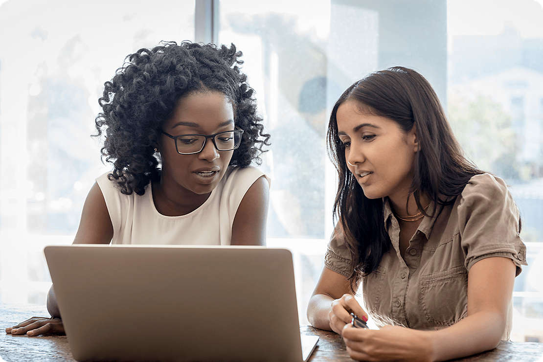 Diverse women working on a laptop