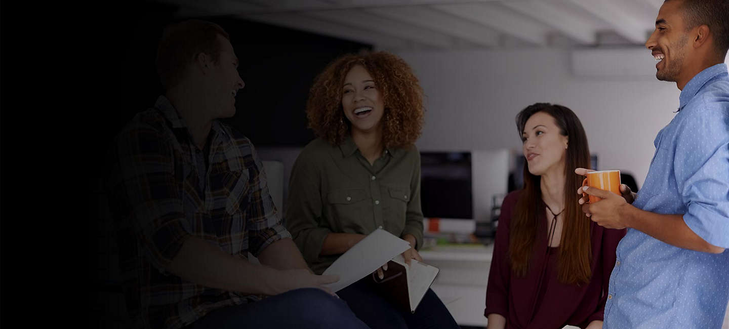 Diverse workers smiling with coffee
