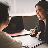 ctive senior woman having discussion with agent about her retirement investment plan