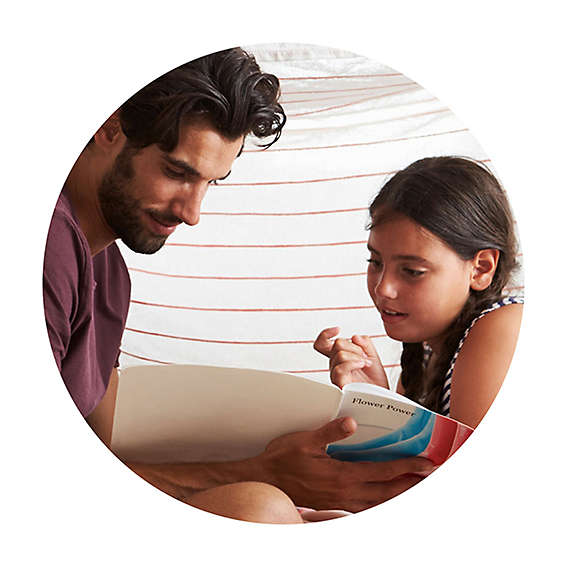 Father and daughter reading a book