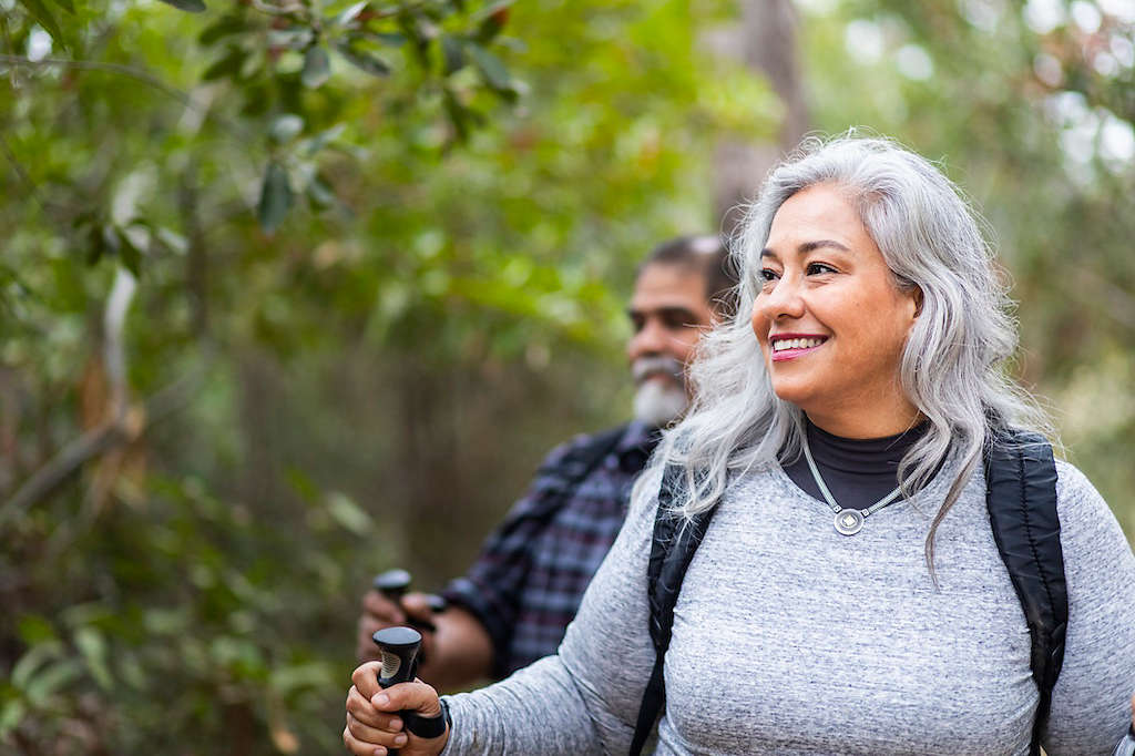 A senior mexican couple hiking