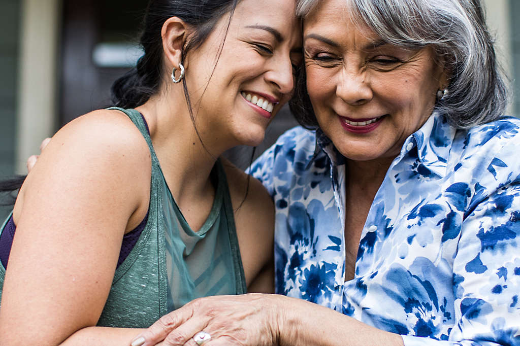 Grandmother hugging granddaughter