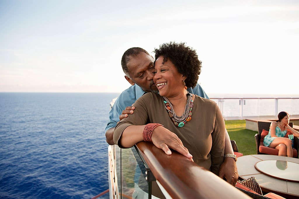 Happy retired couple enjoying a vacation on a cruise ship