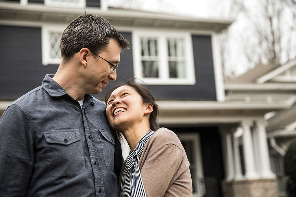 happy couple after refinancing mortgage