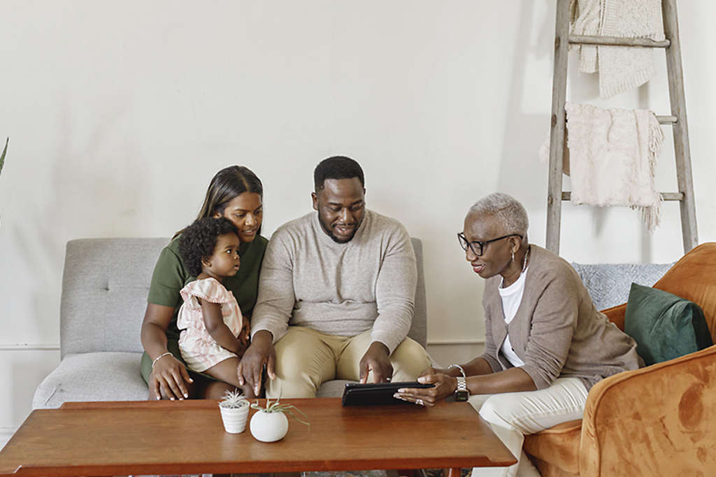 Family looking at financial statements together in living room