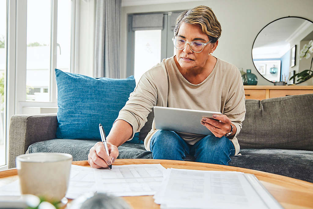 Woman on couch with paperwork