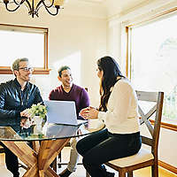 A couple discussing retirement planning with their agent