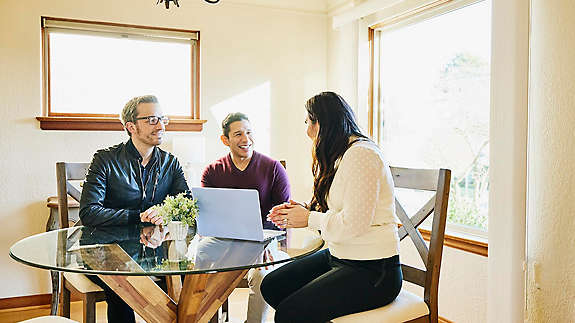 A couple discussing retirement planning with their agent