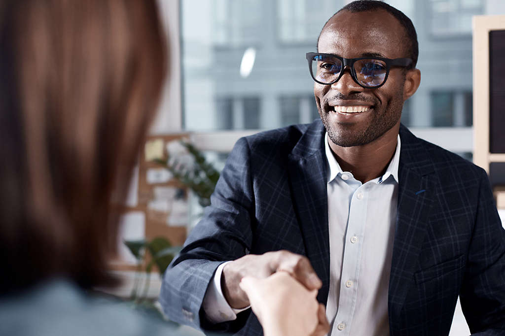 Optimistic qualified man is interviewing lady