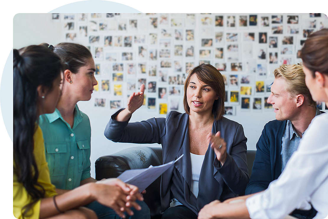 Latin woman mentoring in workplace
