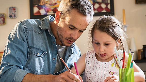 Man working with child