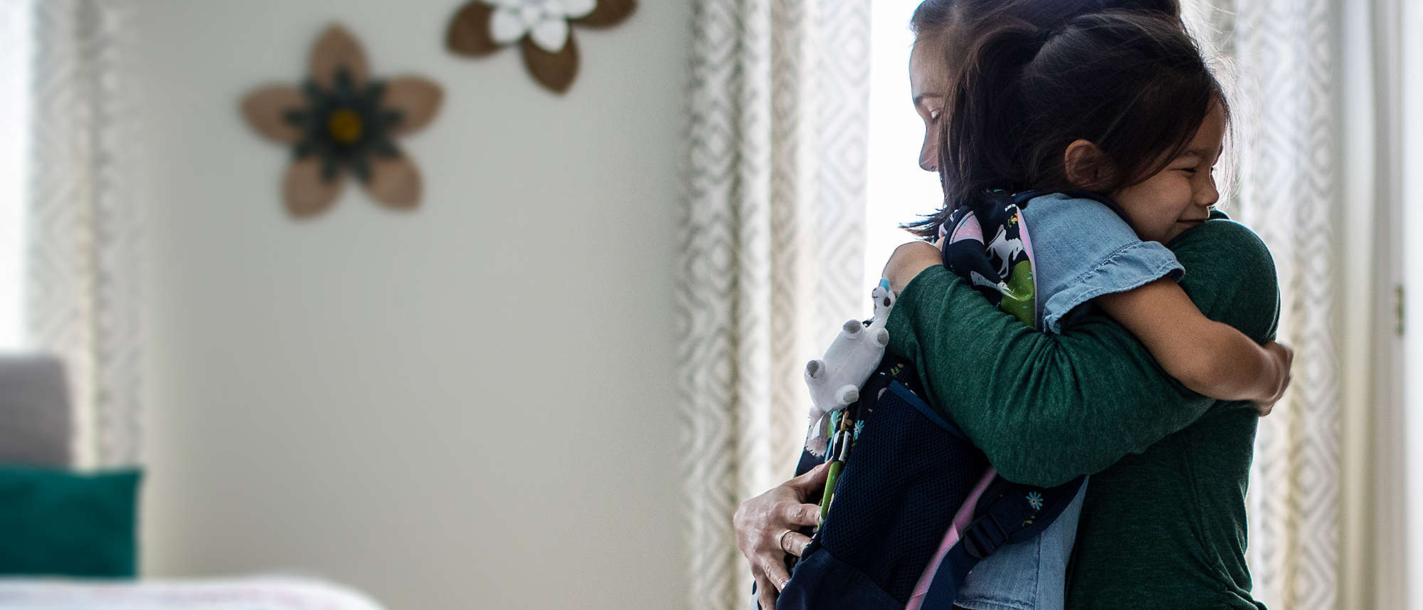 Mother and daughter hugging