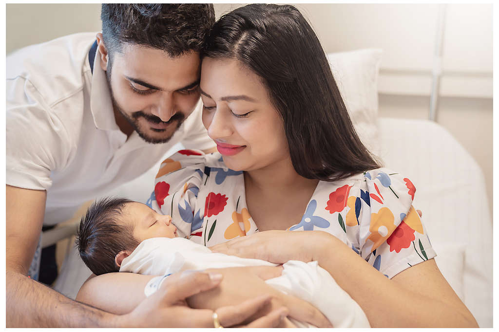 A couple with their newborn baby