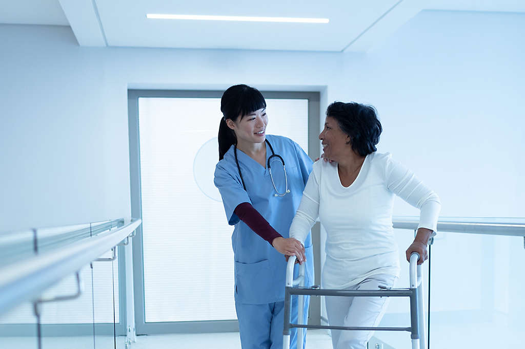  Nurse walking with patient