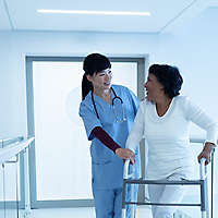  Nurse walking with patient