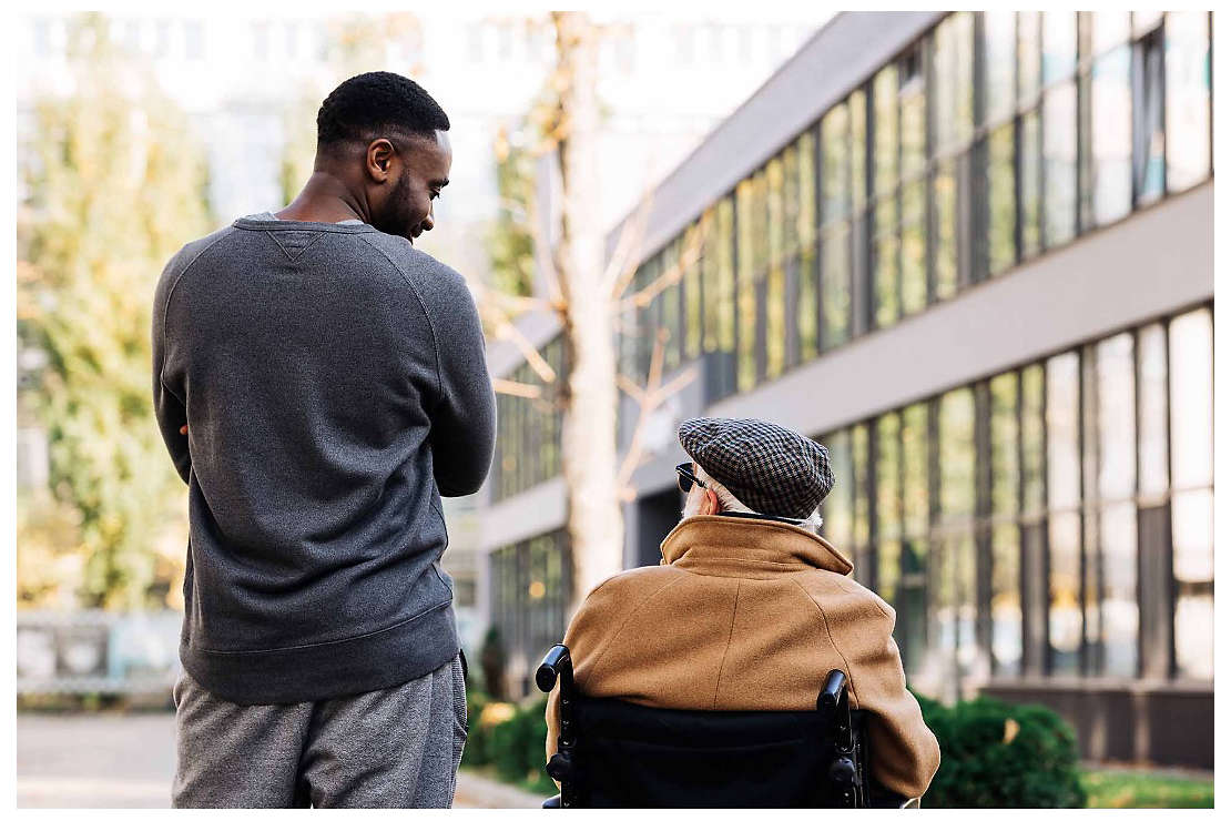 A young man speaking to an elderly friend about his retirement goals.