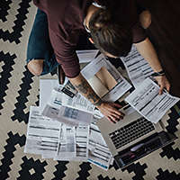 Person at home doing paperwork