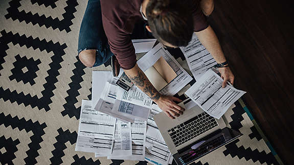 Person at home doing paperwork 