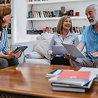 Elderly man and women in living room