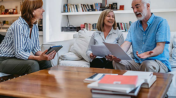 Elderly man and women in living room